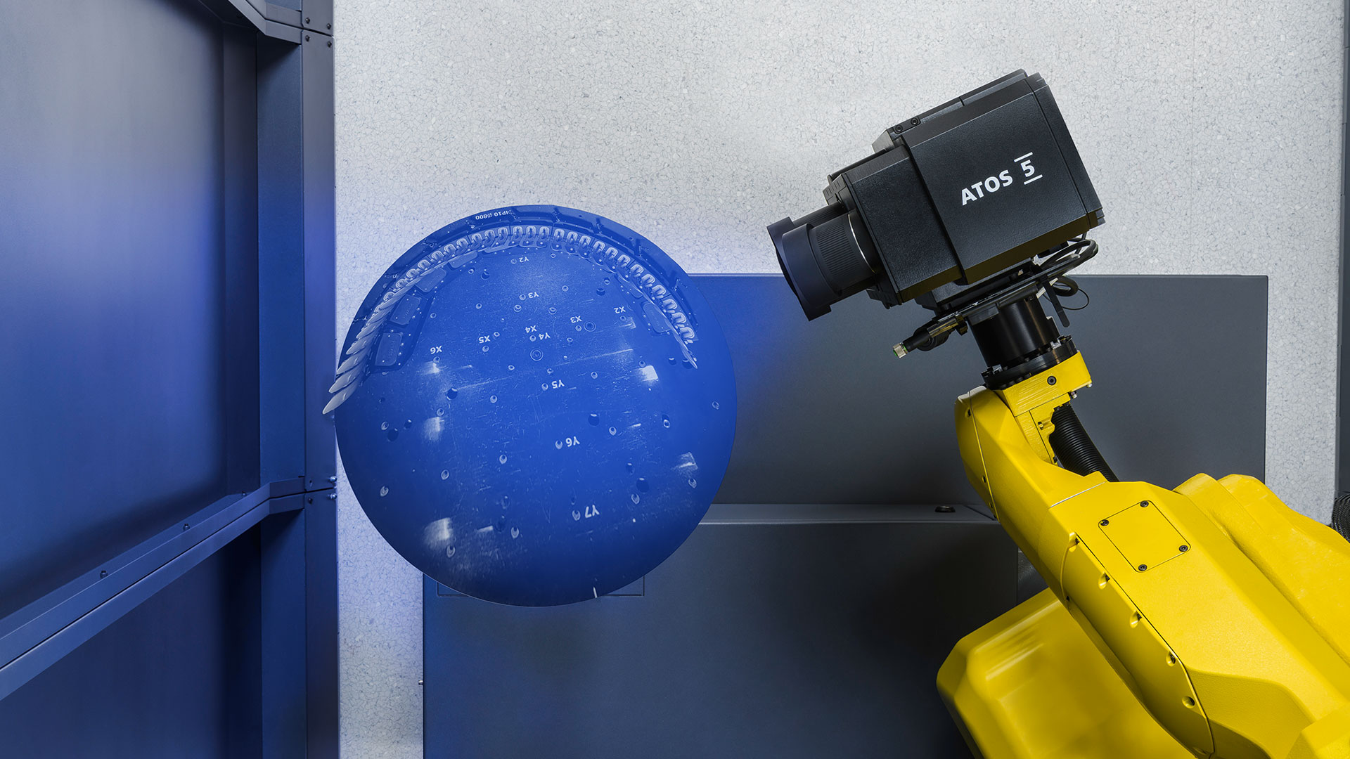 Automated ATOS 5 3D scanning knee implant components on a fixture inside ScanBox.