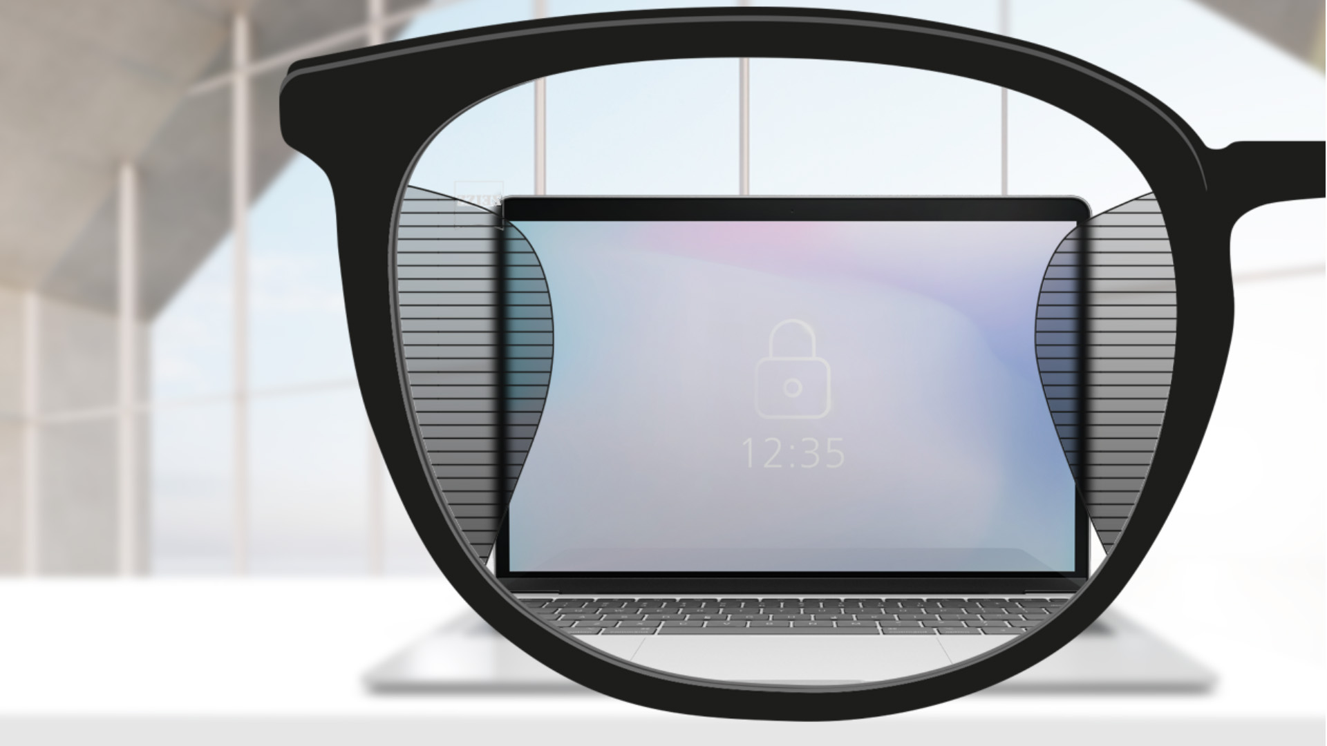 Изображение на гледната точка с лещи ZEISS Office с компютърен екран в центъра на лещата и тънки размазани участъци вляво и вдясно.