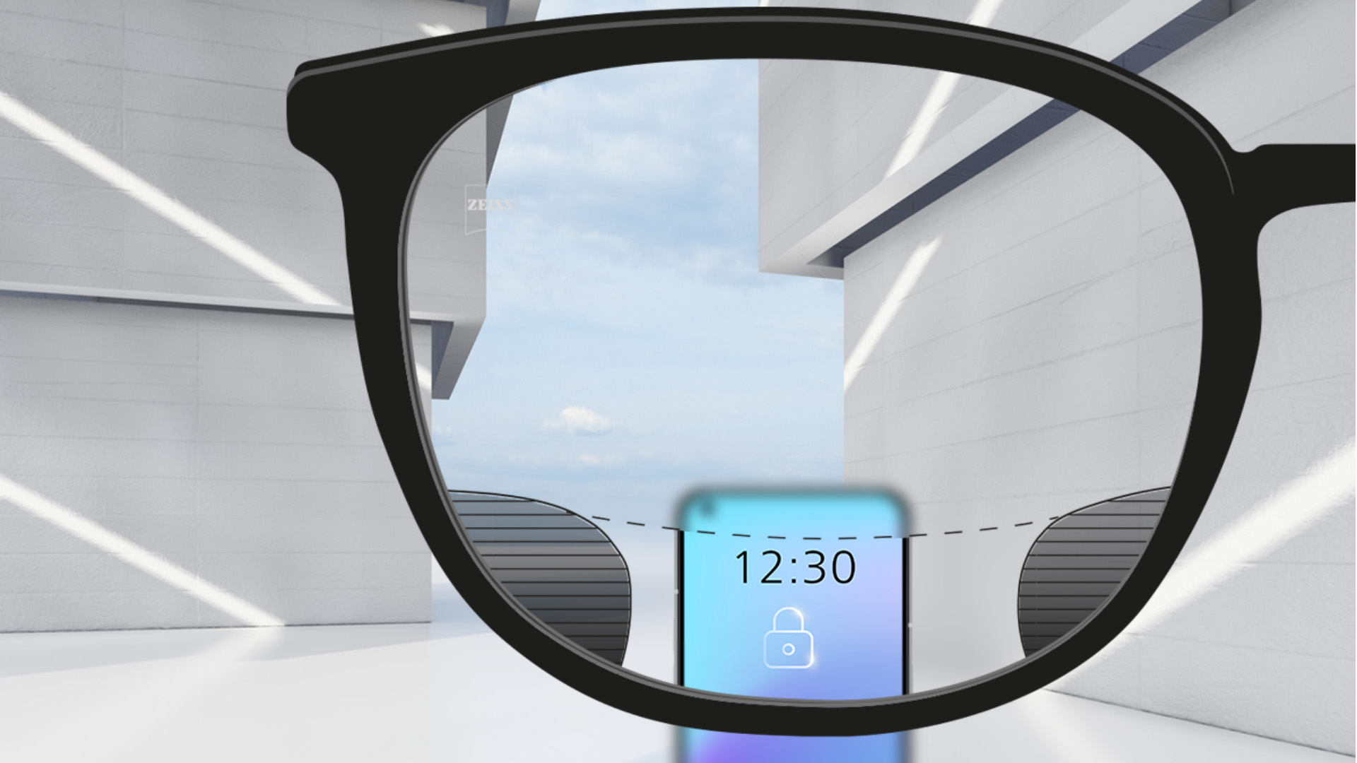 Изображение на гледната точка с лещи ZEISS Digital SmartLife със смартфон, като лещата е напълно ясна в горната и долната си част и малки размазани участъци вляво и вдясно.