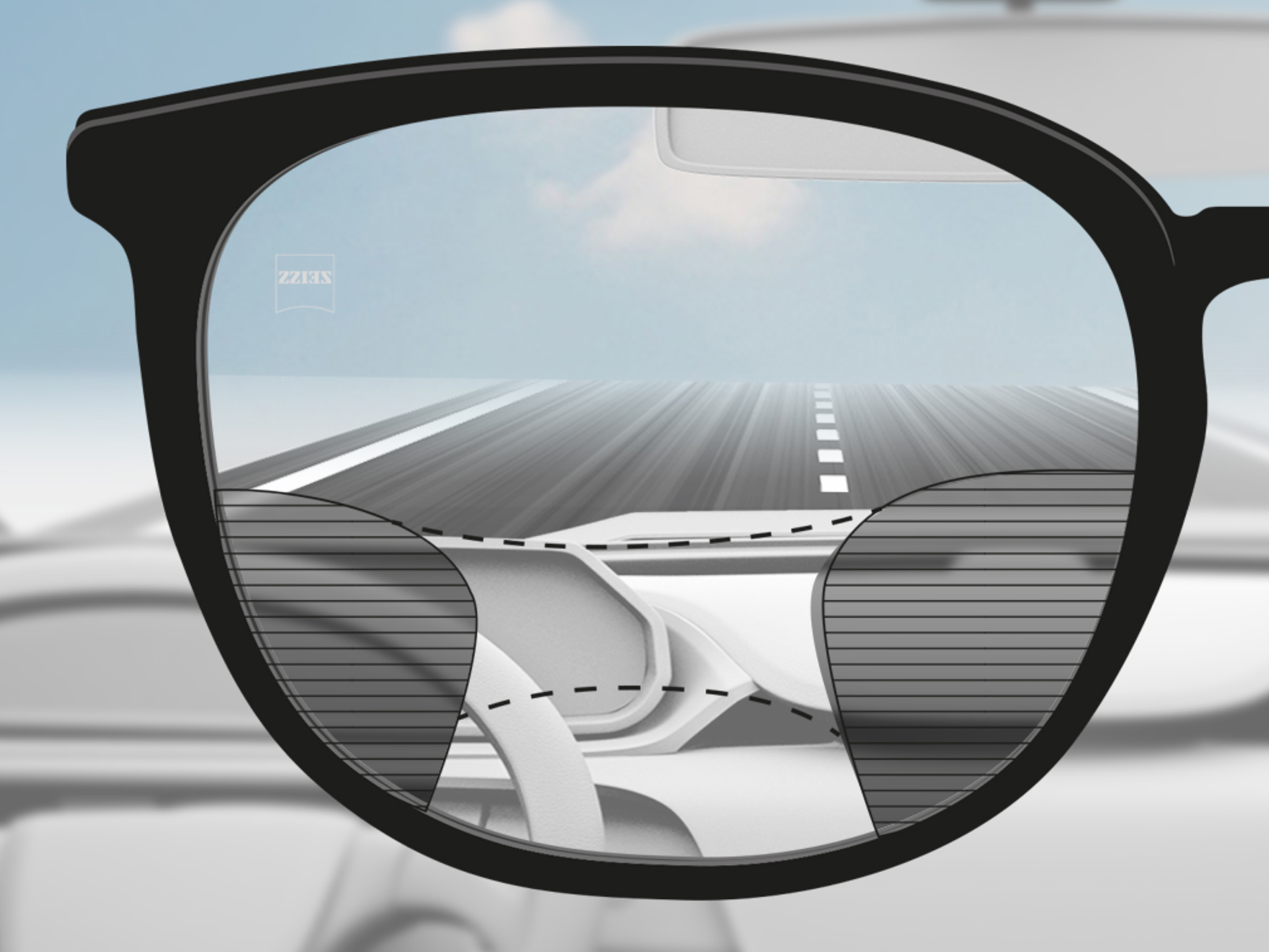 Изображение от гледна точка на леща ZEISS Progressive DriveSafe: Зрителните зони са адаптирани така, че водачът да вижда ясно пътя и арматурното табло.